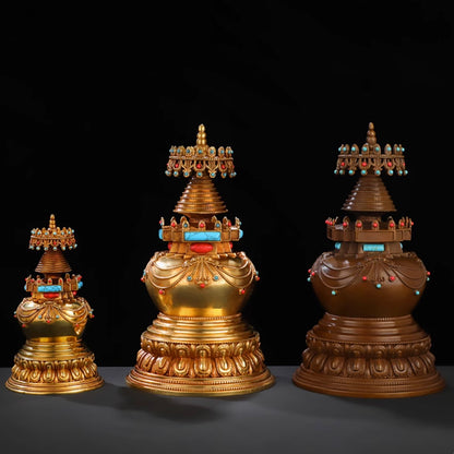 Kadam-style brass stupas with semi-precious stone parasols in three sizes.