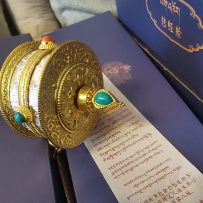 Handcrafted Tibetan Dorje Drollo prayer wheel in pure brass with 12,808 mantras, smooth silent spin, and semi-precious stone inlay for blessings.